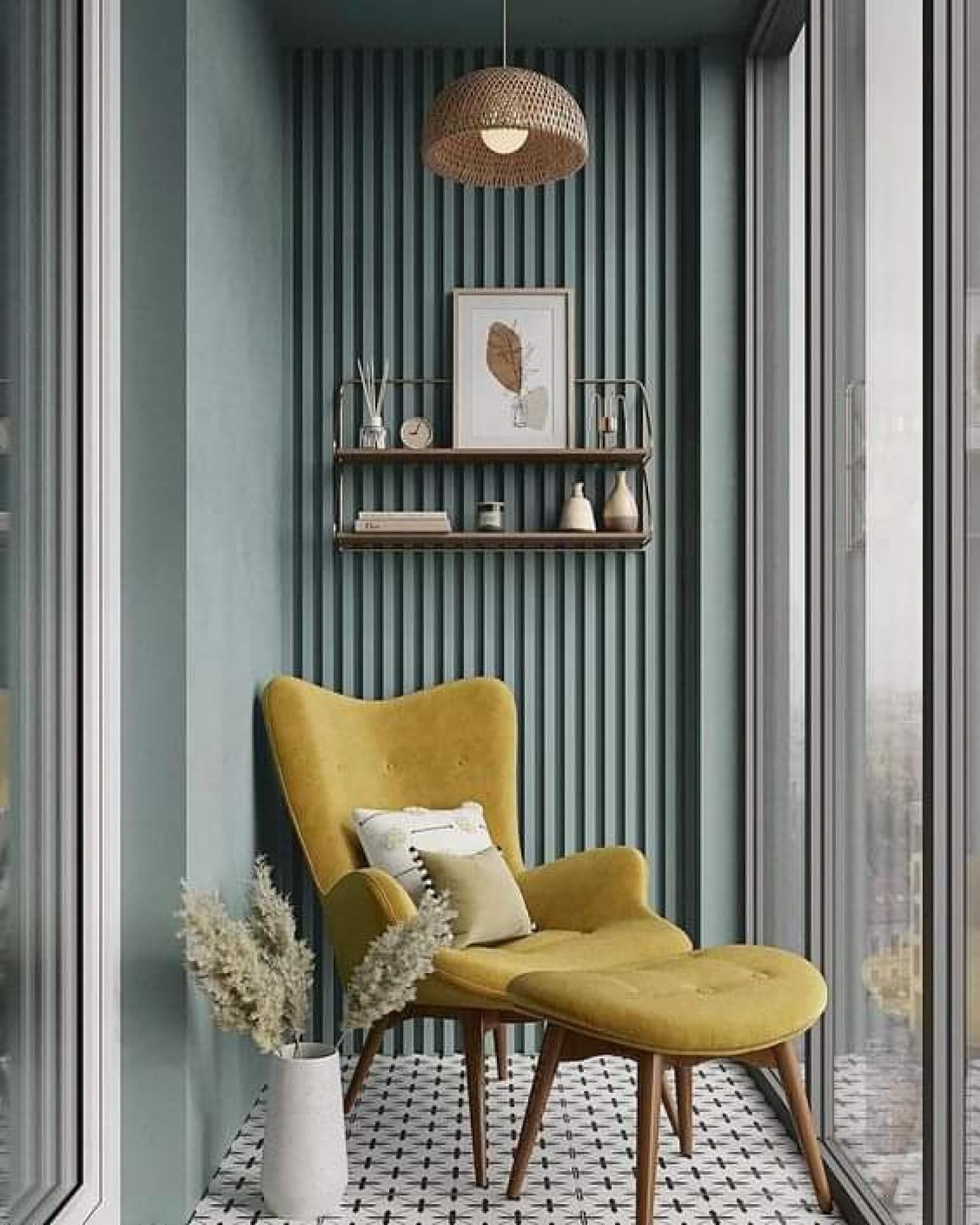 Balcony reading nook with dusty teal vertical slat wall paneling, mustard yellow armchair, and floating shelf.