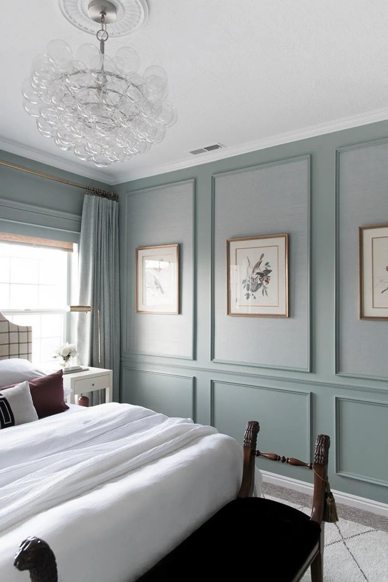Master bedroom with duck-egg blue picture frame wainscoting, white ceiling rose medallion, and bubble glass chandelier.