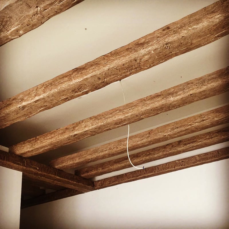 Parallel Light Brown Faux Wood Ceiling Beams