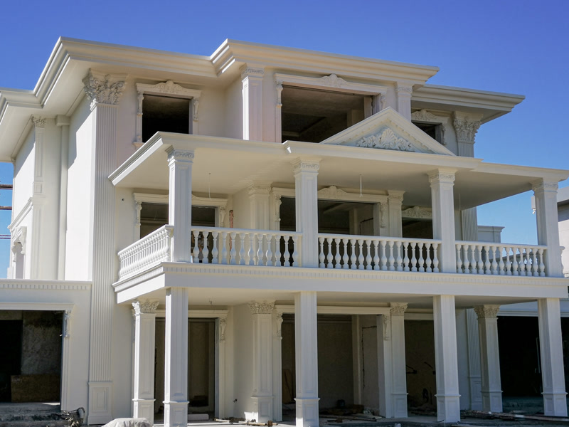 Bright White Villa Facade with Two-Story Porch