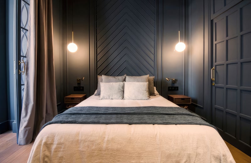 Dark Navy Bedroom with Chevron Slat Accent Wall