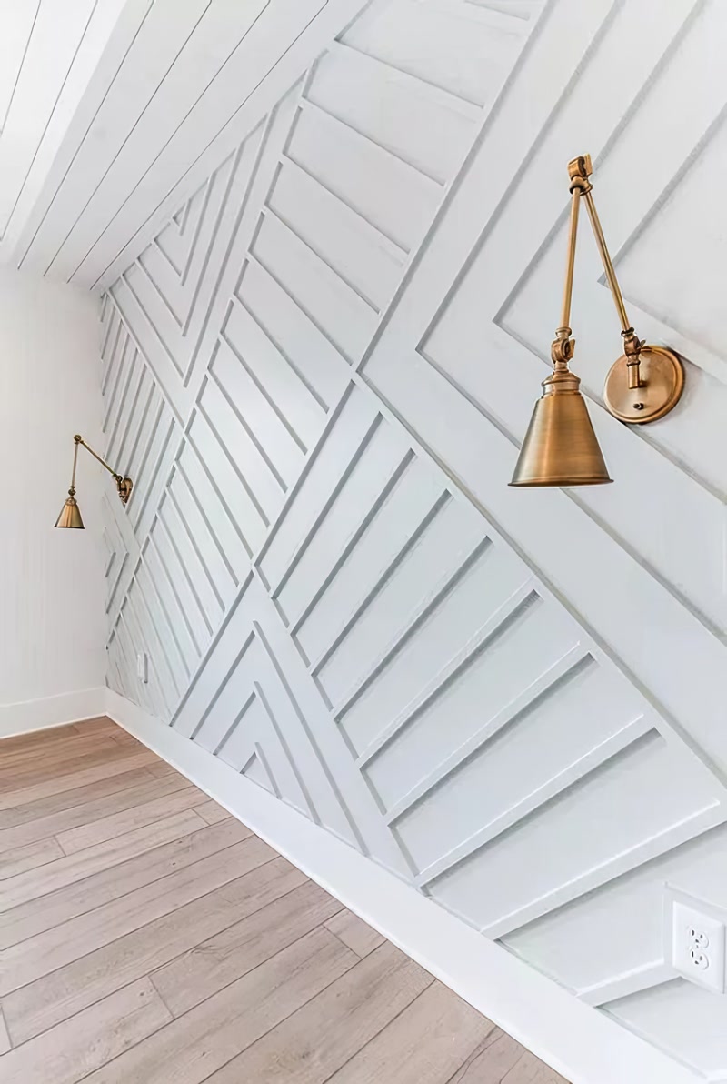 Light Grey Geometric Slat Wall with Brass Sconces