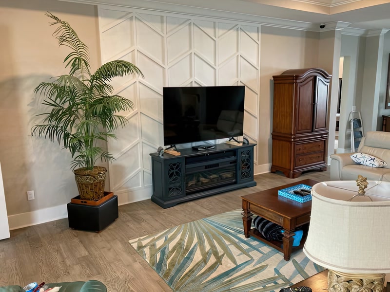 Living Room Media Wall with White Chevron Slat Panel