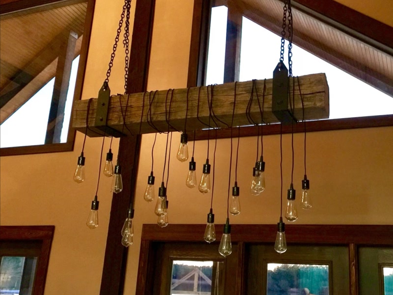 Rustic Timber Beam Chandelier in Vaulted Room