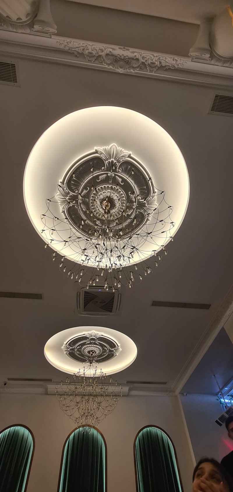 Upward Ceiling Photo of Circular Domes with Chandeliers