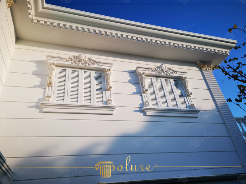 Low Angle View Photo of Facade with Gold Window Crests