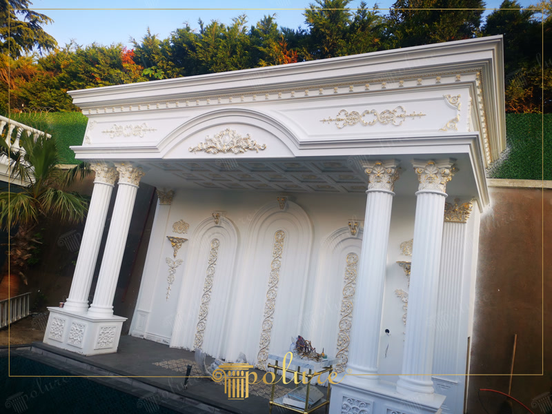 Oblique Photo of White Garden Pavilion with Gold Columns