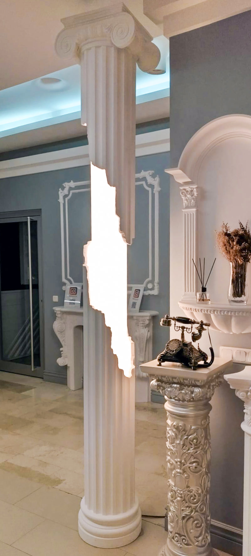 Front View Photo of Showroom Foyer with Illuminated Column