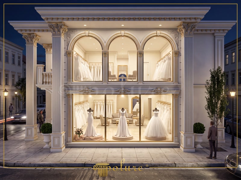 Front View Photo of White and Gold Bridal Shop Storefront at Night