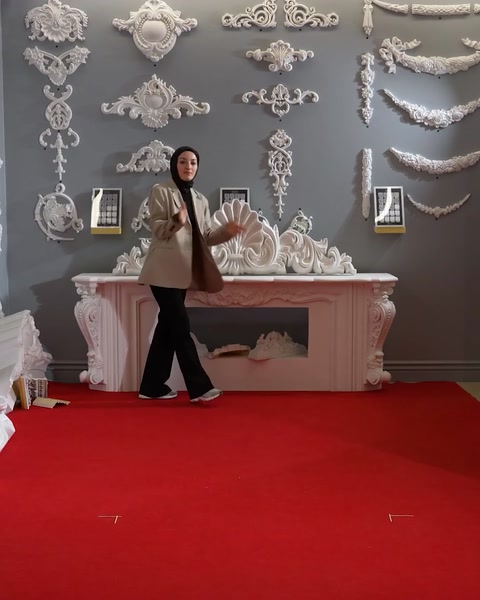 Carrying a polyurethane capital piece across a showroom floor
