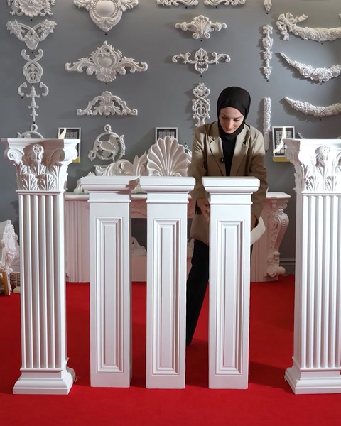Row of finished polyurethane pedestal columns in a display room