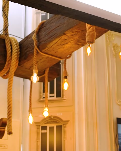 Decorative wooden beam and rope ceiling detail close-up