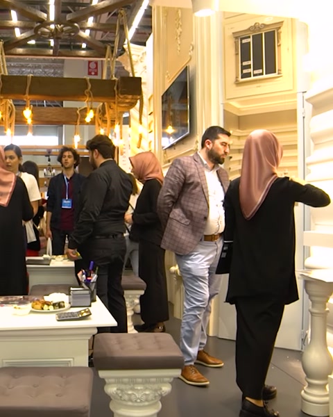 Visitors gathered around seating area with decorative columns