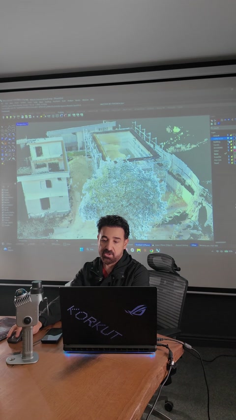 Exterior point cloud data appears within the digital modeling workspace