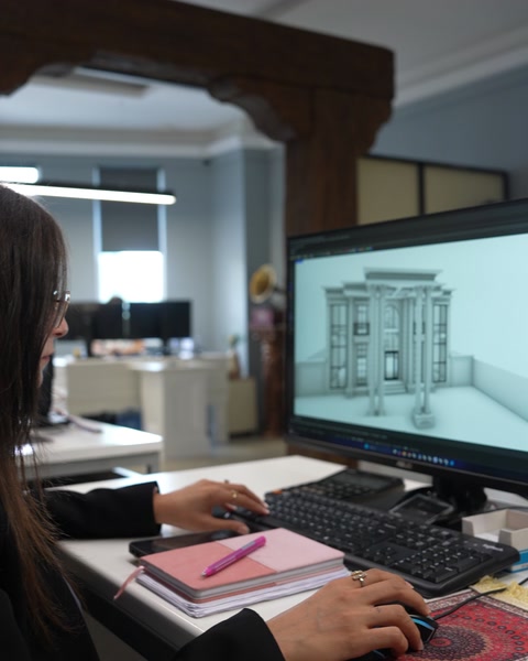 Designer reviewing a classical entrance with columns and moulded surrounds