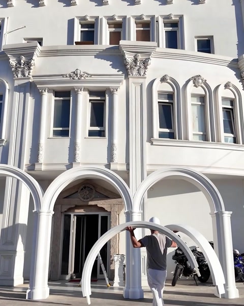 Finished façade with columns, capitals and cornice details