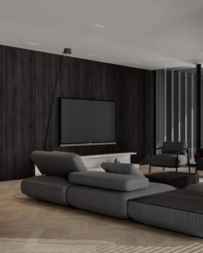 Rustikale Polyurethan-Holzpaneele für elegante TV-Wände im modernen Wohnraum <h2>Rustikale Wandgestaltung trifft modernes Design</h2><p>Die dunkel gehaltenen Paneele aus <strong>Polyurethan</strong> imitieren die Ästhetik von echtem Holz und verleihen der TV-Wand eine edle, zeitlose Atmosphäre. Durch ihre vertikale Ausrichtung entsteht ein harmonisches Raster, das den Raum höher und strukturierter erscheinen lässt.</p><p>Vor dieser Kulisse hebt sich ein TV-Board aus Steinoptik ab, das durch seine helle Farbe eine subtile Balance schafft. Gleichzeitig ergänzt das großzügige graue Loungesofa mit seiner klaren Formensprache den modernen Charakter.</p><h2>Geometrie und Textur im Wohnraum</h2><p>Der Boden in Fischgrätstruktur setzt einen spannenden Kontrast zu den vertikalen Paneelen. Dieses Zusammenspiel von geometrischen Mustern erzeugt einen lebendigen, aber nicht überladenen Gesamteindruck. Die glatte Oberfläche des Sofas steht dabei im Dialog mit der haptischen Tiefe der <strong>Holzpaneele</strong>.</p><p>Eine kurze historische Anmerkung: schon in klassischen Architekturtraditionen wurden Holzvertäfelungen als raumprägende Elemente eingesetzt, häufig zur Akzentuierung und Isolierung. Hier findet diese Idee eine moderne Neuinterpretation.</p><h2>Vorteile und Einsatzmöglichkeiten</h2><ul><li><strong>Leichte Montage</strong> durch Polyurethan-Elemente.</li><li>Optisch warme und natürliche Wirkung trotz moderner Reduktion.</li><li>Harmonische Verbindung aus <strong>klassisch</strong> und modern.</li><li>Ideal für Wohnzimmer mit TV-Zonen und dekorativen Akzenten.</li></ul><p>Durch die Kombination aus eleganten <strong>Paneelen</strong> und reduzierter Möblierung entsteht eine ausgewogene Gesamtkomposition, die für zeitgemäße Wohnkonzepte hervorragend geeignet ist.</p>
<p>Die Wandgestaltung mit dunklen <strong>Holzpaneelen</strong> schafft ein edles Ambiente. Die Polyurethan-Elemente sind leicht zu montieren. Ihre vertikale Struktur vermittelt Klarheit. Ein helles TV-Board setzt gezielte Kontraste. Das Sofa in gedecktem Grau wirkt modern und harmonisch. Die <strong>Fischgrätstruktur</strong> des Bodens verleiht Dynamik. Die Kombination von Linien und Maserungen ist ausgewogen. Dunkle und helle Materialien ergänzen sich. Der Raum erhält ein Spiel aus Tiefe und Leichtigkeit. Die <strong>Polyurethan</strong>-Paneele sind pflegeleicht. Klassische Vertäfelung wird neu interpretiert. Diese Gestaltung passt in moderne Wohnkonzepte. Sie vereint Tradition und moderne Eleganz. Die geometrischen Muster unterstreichen das Design. Insgesamt entsteht ein stilvolles, wohnliches Konzept.</p>