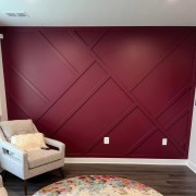 Modern Classic Living Room with Burgundy Accent Wall and Subtle Accessories