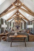 Rustic Living Room with Exposed Wooden Beams and Stone Fireplace