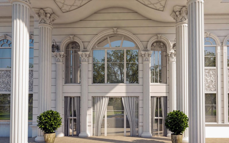 Eleganza classica con dettagli in poliuretano all’ingresso di una villa <h2>Ingresso classico con dettagli raffinati</h2><p>L’ingresso della villa si distingue per l’uso di <strong>colonne</strong> imponenti con scanalature verticali e capitelli finemente scolpiti in stile corinzio, che richiamano i canoni dell’architettura antica. La disposizione delle strutture crea un equilibrio visivo che conferisce stabilità e prestigio.</p><p>I rilievi in <strong>poliuretano</strong> decorano le superfici laterali con motivi floreali e intrecci geometrici, arricchendo la facciata senza appesantirla. Questi inserti ornamentali sono leggeri e resistenti, rendendoli ideali per l’estetica classica contemporanea.</p><h2>Archi, cornici e proporzioni</h2><p>Le finestre ad arco, con cornici ritmate, introducono un gioco di simmetrie che amplifica l’effetto scenografico dell’ingresso. Al centro, un’ampia apertura con tende leggere incornicia l’ingresso principale, favorendo la continuità visiva tra interno ed esterno.</p><p>Soffitti con sagome curve e rilievi armonici completano la composizione, mentre i vasi con vegetazione ordinata aggiungono un tocco naturale alla solennità della struttura.</p><h2>Un richiamo storico</h2><p>L’uso dei capitelli corinzi e delle colonne scanalate si ispira direttamente alla tradizione dell’antica Grecia e di Roma, simbolo di potere e raffinatezza estetica. Questo linguaggio architettonico rimane ancora oggi un modello di equilibrio e <strong>armonia</strong> decorativa.</p><ul><li>Colonne scanalate con capitelli corinzi in <strong>poliuretano</strong></li><li>Decorazioni floreali in rilievo</li><li>Archi e grandi superfici vetrate</li><li>Soffitti sagomati con motivi geometrici</li></ul>
<p>L’ingresso di questa villa rappresenta un perfetto equilibrio tra imponenza e raffinatezza. Le colonne scanalate con capitelli corinzi evocano la maestosità classica. Gli archi armoniosi creano continuità estetica. I rilievi floreali in <strong>poliuretano</strong> alleggeriscono la struttura. Le finestre ad arco aumentano la luminosità. Il soffitto con motivi decorativi dona profondità elegante. I dettagli scolpiti trasmettono un senso di <strong>armonia</strong>. I vasi con vegetazione aggiungono naturalezza. Le cornici accentuano la verticalità architettonica. Gli elementi simmetrici rafforzano l’ordine compositivo. L’uso del <strong>poliuretano</strong> consente precisione e leggerezza. La facciata si distingue per equilibrio proporzionale. Le linee geometriche definiscono ordine e chiarezza. La tradizione greco-romana rivive in forma moderna. Lo sguardo è guidato verso il portale centrale. Questo ingresso comunica eleganza senza tempo.</p>