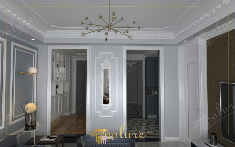 Elegante salotto neoclassico con dettagli in poliuretano <h2>Dettagli architettonici in poliuretano</h2><p>I dettagli in <strong>poliuretano</strong> valorizzano il soffitto e le pareti del salotto con cornici geometriche e motivi a foglia che evocano l’eleganza del passato. Questo materiale leggero e resistente permette di realizzare decorazioni precise, arricchendo l’ambiente senza appesantirlo.</p><h2>Combinazione di stile neoclassico e moderno</h2><p>La palette cromatica unisce toni grigio perla e bianco candido in un equilibrio raffinato, mentre il <strong>lampadario</strong> in ottone con forme radiali porta un tocco di modernità. Le cornici murali geometriche, arricchite da modanature e motivi floreali, definiscono lo spazio visivo con grande cura estetica.</p><h2>Elementi decorativi</h2><p>Lo specchio verticale incorniciato da rilievi ornamentali in stile <strong>classico</strong> amplifica la luminosità degli interni. Le modanature sul soffitto con un disegno a foglie intrecciate richiamano l’arte antica, ricordando i fregi architettonici tipici delle dimore aristocratiche.</p><h2>Materiali e atmosfera</h2><p>Il pavimento in legno del corridoio trasmette calore e familiarità, mentre le superfici in marmo e vetro offrono un senso di <strong>eleganza</strong>. L’uso della simmetria nelle decorazioni e la disposizione accurata dei punti luce creano un ambiente armonioso e funzionale. Brevi richiami alla tradizione storica del neoclassico, nato nel XVIII secolo per riscoprire l’ordine classico greco-romano, testimoniano la continuità del linguaggio architettonico.</p>

<p>Il salotto neoclassico con dettagli in <strong>poliuretano</strong> rappresenta un esempio di eleganza senza tempo. Le modanature bianche creano un contrasto raffinato con le pareti grigio perla. I motivi geometrici e floreali scolpiti arricchiscono le cornici murali. Il <strong>lampadario</strong> moderno in ottone si integra armoniosamente allo stile classico. Lo specchio ornamentale con rilievi dona profondità e luce all’ambiente. Il soffitto con fregi a foglie intrecciate richiama tradizioni antiche. Gli elementi in <strong>marmo</strong> conferiscono solidità estetica e prestigio. Il corridoio con pavimento in legno aggiunge calore visivo. L’atmosfera bilancia lusso e comfort quotidiano. L’uso del <strong>vetro</strong> e dei riflessi amplia gli spazi percepiti. La simmetria delle composizioni rafforza la sensazione di ordine. Le luci integrate sottolineano i rilievi decorativi. L’armonia di stili antichi e moderni genera un equilibrio visivo. I dettagli artigianali dimostrano attenzione al particolare. Il risultato finale è un interiore elegante e accogliente.</p>
