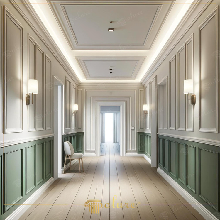 Corredor clássico moderno com molduras e rodapés de poliuretano <h2>Elegância moderna com molduras e rodapés</h2><p>O corredor apresenta um equilíbrio visual notável entre tradição e inovação através do uso de molduras de <strong>poliuretano</strong> aplicadas de forma simétrica nas paredes. Essas composições retangulares acrescentam profundidade, ritmo e uma sensação de continuidade ao longo do espaço.</p><p>Na parte inferior das paredes, os painéis em tom verde suave introduzem uma camada de <strong>contraste</strong> que realça a sobriedade do bege claro superior. Essa divisão cromática funciona como um recurso estético clássico e, ao mesmo tempo, um elemento contemporâneo de personalização.</p><p>O teto, detalhado com rebaixos geométricos, é iluminado por fitas de LED embutidas que criam uma atmosfera de destaque sutil. Essa <strong>iluminação</strong> indireta valoriza os volumes e dá profundidade ao design, conferindo ao ambiente uma sensação ampla e sofisticada.</p><p>O piso em madeira clara acompanha a direção longitudinal do corredor, prolongando a perspectiva visual e conectando de maneira fluida os espaços. O <strong>rodapé</strong> de poliuretano reforça o acabamento elegante, garantindo transição harmoniosa entre paredes e pavimento.</p><p>Historicamente, o uso de molduras como ornamento já se destacava nas tradições arquitetônicas gregas e romanas, onde a repetição rítmica de painéis e relevos trazia ordem e imponência aos ambientes. Nesta proposta, esse legado foi reinterpretado em versão minimalista e inovadora.</p><ul><li>Painéis inferiores verdes como base contrastante</li><li>Detalhamento geométrico em molduras clássicas</li><li>Iluminação indireta contemporânea</li><li>Piso de madeira clara para fluidez espacial</li></ul>

<p>Este corredor em estilo clássico moderno combina o uso de molduras de <strong>poliuretano</strong> com painéis geométricos elegantes. As formas retangulares criam ritmo visual e valorizam as proporções do espaço. Os painéis inferiores em verde suave conversam harmonicamente com o tom bege superior das paredes. O teto rebaixado recebe iluminação indireta que reforça a profundidade dos volumes. O uso de linhas retas traz simplicidade dentro do contexto clássico. O <strong>rodapé</strong> de poliuretano garante um acabamento contínuo e refinado. O piso em madeira clara amplia a perspectiva e guia o olhar para além do corredor. A composição luminosa com arandelas adiciona aconchego e sofisticação. A dualidade entre tradição e modernidade é equilibrada pela escolha dos elementos. A <strong>iluminação</strong> embutida destaca cada detalhe arquitetônico. A repetição dos painéis transmite ordem e continuidade. O contraste cromático entre verde e bege reforça a identidade única do espaço. O uso de <strong>geometria</strong> nos detalhes amplia a sensação de movimento. Esta proposta é uma inspiração prática para quem busca harmonia clássica e contemporânea. O resultado final é um ambiente acolhedor, elegante e atemporal.</p>